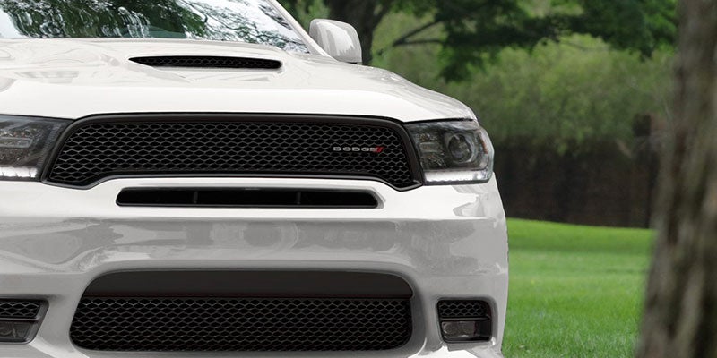 Close up of the headlight and hood of a Dodge Durango