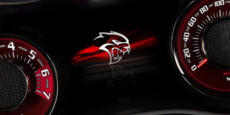 Close up of a Dodge Challenger's pedometer and it's new logo
