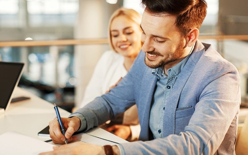 couple signing financing form