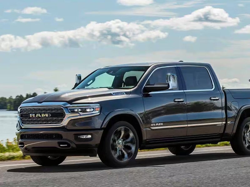 Dan Cummins Chrysler Dodge Jeep Ram Georgetown in Georgetown KY Dodge Ram 1500 driving lakeside