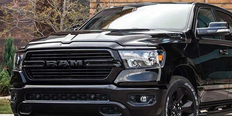 Dan Cummins Chrysler Dodge Jeep Ram Georgetown in Georgetown KY Dodge Ram 1500 parked in driveway