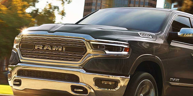 Dan Cummins Chrysler Dodge Jeep Ram Georgetown in Georgetown KY Dodge Ram 1500 front view at sunset