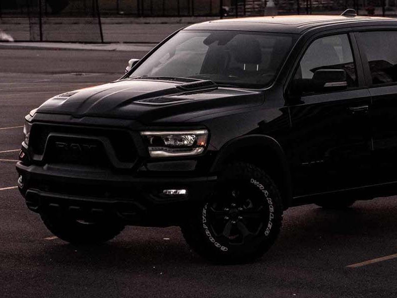 Dan Cummins Chrysler Dodge Jeep Ram Georgetown in Georgetown KY Dodge Ram 1500 lights on at dusk