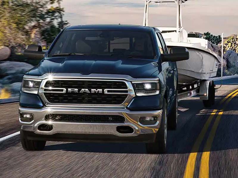 Dan Cummins Chrysler Dodge Jeep Ram Georgetown in Georgetown KY Ram 1500 pulling a trailer