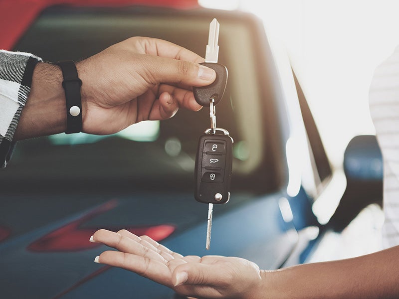 Dan Cummins Chrysler Dodge Jeep Ram Georgetown in Georgetown KY customer being handed keys to a new Ram