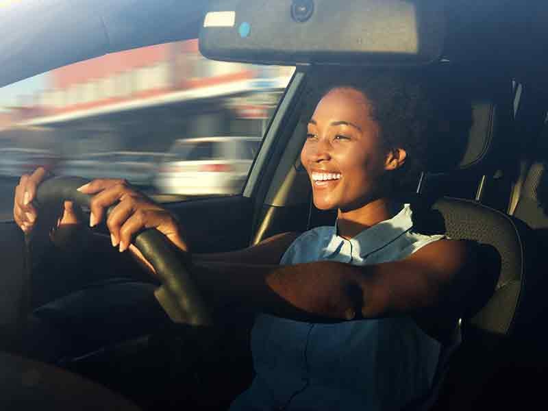 Dan Cummins Chrysler Dodge Jeep Ram Georgetown in Georgetown KY customer driving in her new used Jeep Wrangler