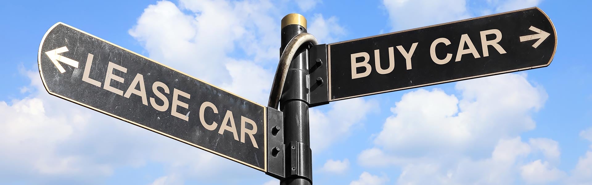 Road sign showing Lease Car and Buy Car direction